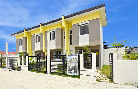 Rent-to-Own Pacifictown Naic townhouse model facade with gate and fence included upon turnover.